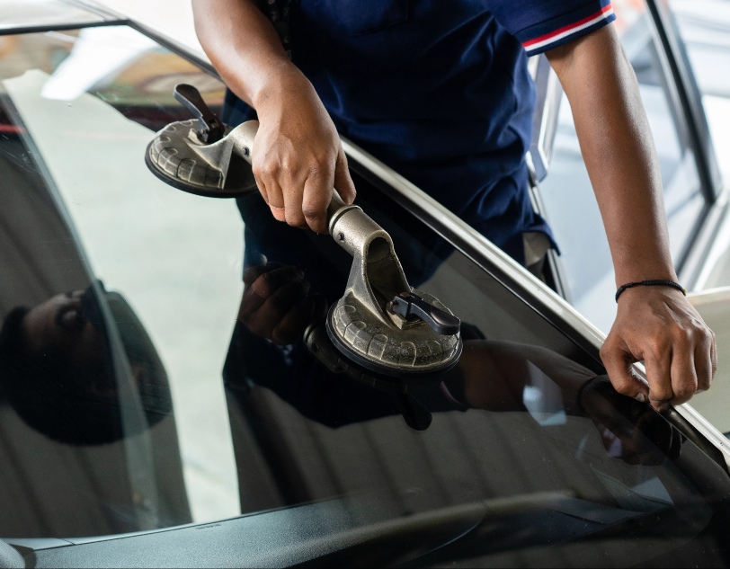 Man working when replacing windshield