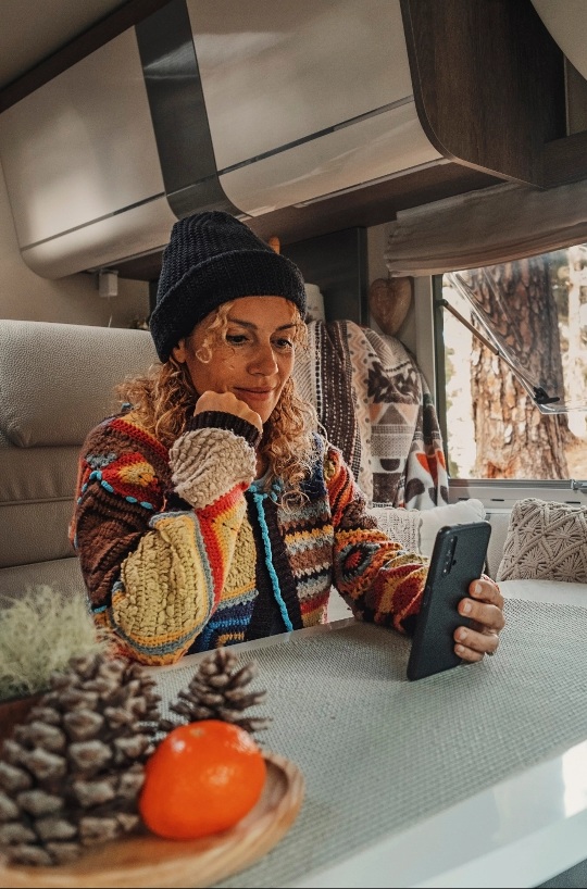 Woman in a rv using phone